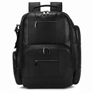 Detailed front view of black leather backpack with multiple zip pockets and metal hardware.