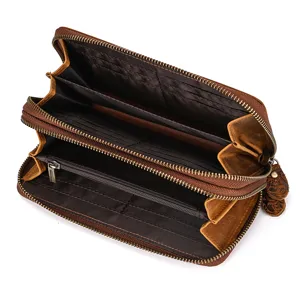 Detailed view of the interior card slots and double zipper compartments of the leather wallet.