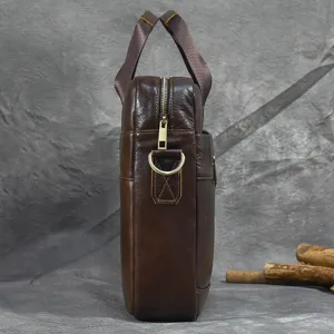 Side detail view of a dark brown genuine leather men business briefcase with zipper and D-ring.