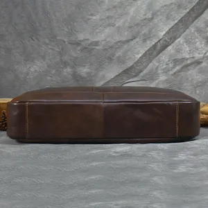 Men's leather briefcase bottom detail view, premium cowhide business laptop bag close-up.