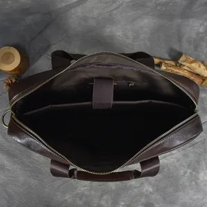 Detailed view of the dark brown genuine leather men business laptop briefcase with multi-compartments.