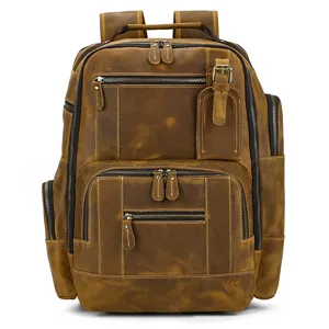 Close-up detail of the vintage leather backpack showing multiple compartments and durable zippers.
