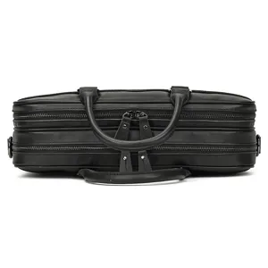 Detail shot of black leather briefcase showing double zippers, top handles and metal hardware.