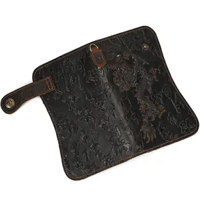 Detail view of vintage genuine leather long wallet with embossed dragon pattern and card slots.
