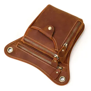 Vintage leather tactical drop leg bag detail, multi-pocket waist pouch with metal zippers.