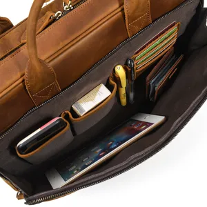Detailed view of leather briefcase interior showing multi-functional card slots and compartments.