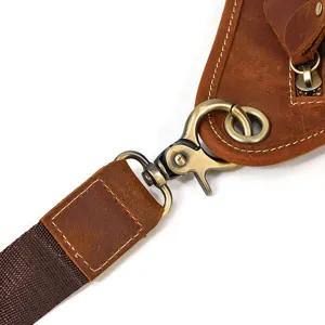 Genuine leather tactical waist bag detail showing vintage bronze metal hardware hook.
