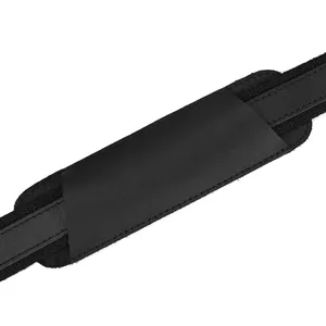 Black genuine leather shoulder strap pad detail for business briefcase and messenger bag.