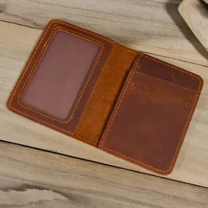 Close up detail of vintage brown genuine leather bi fold card holder with ID window slot.