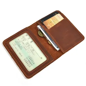 Detailed view of genuine leather bifold card holder wallet with ID window and coin pocket.