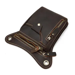 Detailed view of vintage genuine leather tactical leg bag multi-pocket brown waist bag.