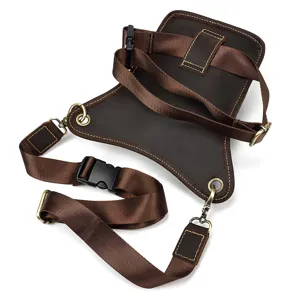 Close-up detail view of men brown leather drop leg bag, showing adjustable straps and buckles.