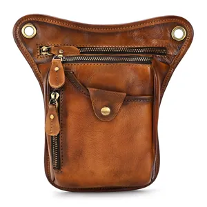 Detailed view of vintage leather drop leg bag, men's tactical waist pouch with multi zippers.
