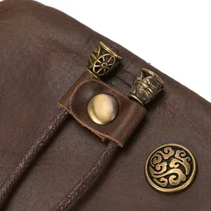 Detailed shot of retro crazy horse leather purse with vintage metal beads and buttons.