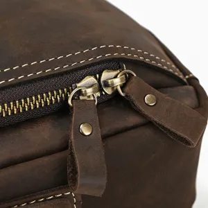 Close-up detail of vintage leather bag zipper and metal pull tab, exquisite craftsmanship.