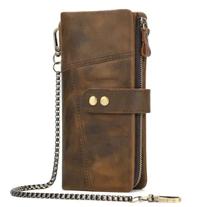 Vintage distressed leather long wallet detail showing metal chain and secure snap button.