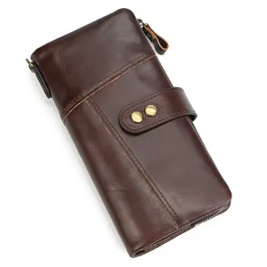 Vintage genuine leather long wallet detail shot showcasing exquisite stitching and dual snap button design.