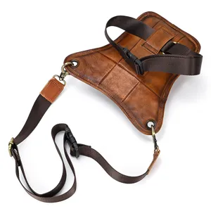 Close-up detail of the vintage genuine leather drop leg bag, showing textured burnished leather.