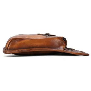 Side profile detail view of vintage genuine leather waist bag showing rich texture.