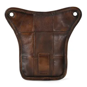 Vintage genuine leather leg bag detail shot, brown vegetable-tanned tactical waist pouch.