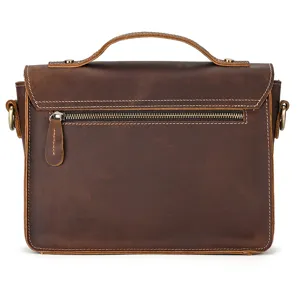 Retro brown crazy horse leather messenger bag detail, showing fine stitching and metal zipper.