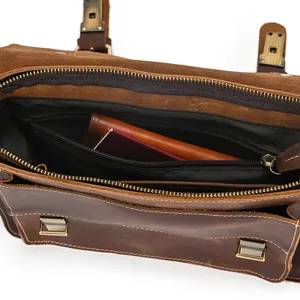 Detailed view of the vintage crazy horse leather messenger bag interior compartment and zipper pocket.
