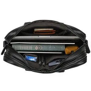 Interior detail view of black leather business briefcase with multiple compartments.