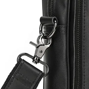 Leather briefcase detail shot highlighting premium black cowhide, durable metal hardware.