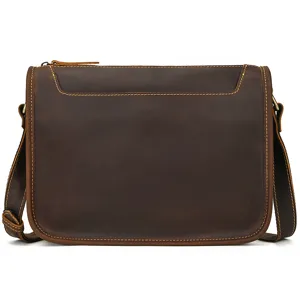 Detailed view of vintage leather messenger bag, crafted with durable brown crazy horse leather.
