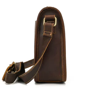 Detail view of the men's vintage crazy horse leather shoulder bag side strap and hardware.
