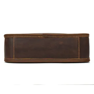 Leather bag bottom detail closeup showing vintage crazy horse leather texture and stitching.