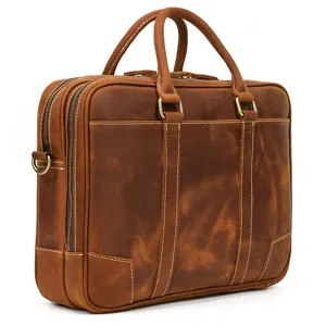 Brown leather business briefcase detail shot, showcasing premium cowhide texture and double zippers.