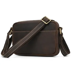 Close-up detail view of the dark brown crazy horse leather vintage men's crossbody bag.