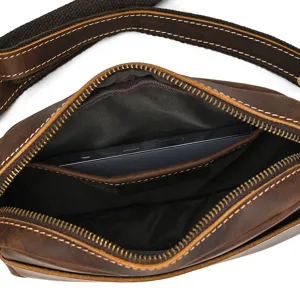 Close-up detail view of brown crazy horse leather men's messenger bag interior pocket.
