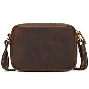 Detail shot of a retro men's genuine leather shoulder bag in dark brown crazy horse leather.