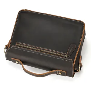Detailed view of retro crazy horse leather men messenger bag zipper hardware and stitching.