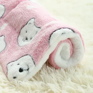 Detailed view of soft thickened plush pet mat, cozy warm dog blanket with cute animal print.