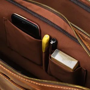 Interior detail view of men leather briefcase showing multiple storage pockets and compartments.