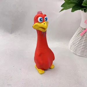 Red rubber squeaky toy for dogs pet chewing interactive cute cartoon design detail view.