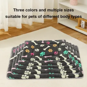 Detail view of thickened warm pet mat with cute paw and bone prints for cats and dogs