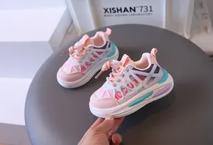 Close-up of breathable pink mesh kids sneakers with convenient lace locks for toddlers