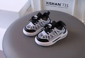 Side view detail of breathable toddler sneakers featuring mesh upper and elastic toggle laces