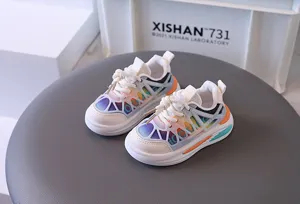 Close-up of vibrant rainbow mesh sneakers with a modern toggle lacing system for kids