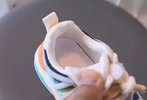 Detail shot of the breathable mesh lining and soft padded heel of the children's sneaker