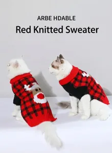 Close-up detail of cute red and black plaid Christmas pet sweater for cats and dogs.