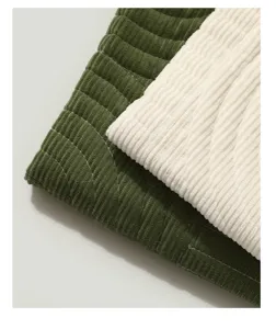Corduroy pet mat fabric close up detail showing soft texture and neat stitching lines.