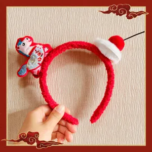 2026 Chinese New Year red plush headband with cute pony embroidery and festive mini hat.