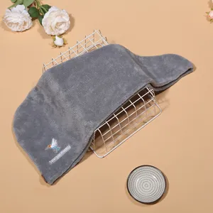 Detail shot of the grey coral velvet dry hair cap, showing the soft texture and embroidery.