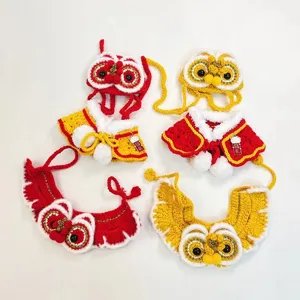 Handmade crochet lion dance pet hat and cape set for cats, Chinese style festive pet accessories.