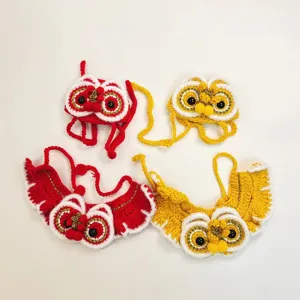 Handcrafted crochet pet lion dance hat and cape set, festive Chinese style cat accessories.